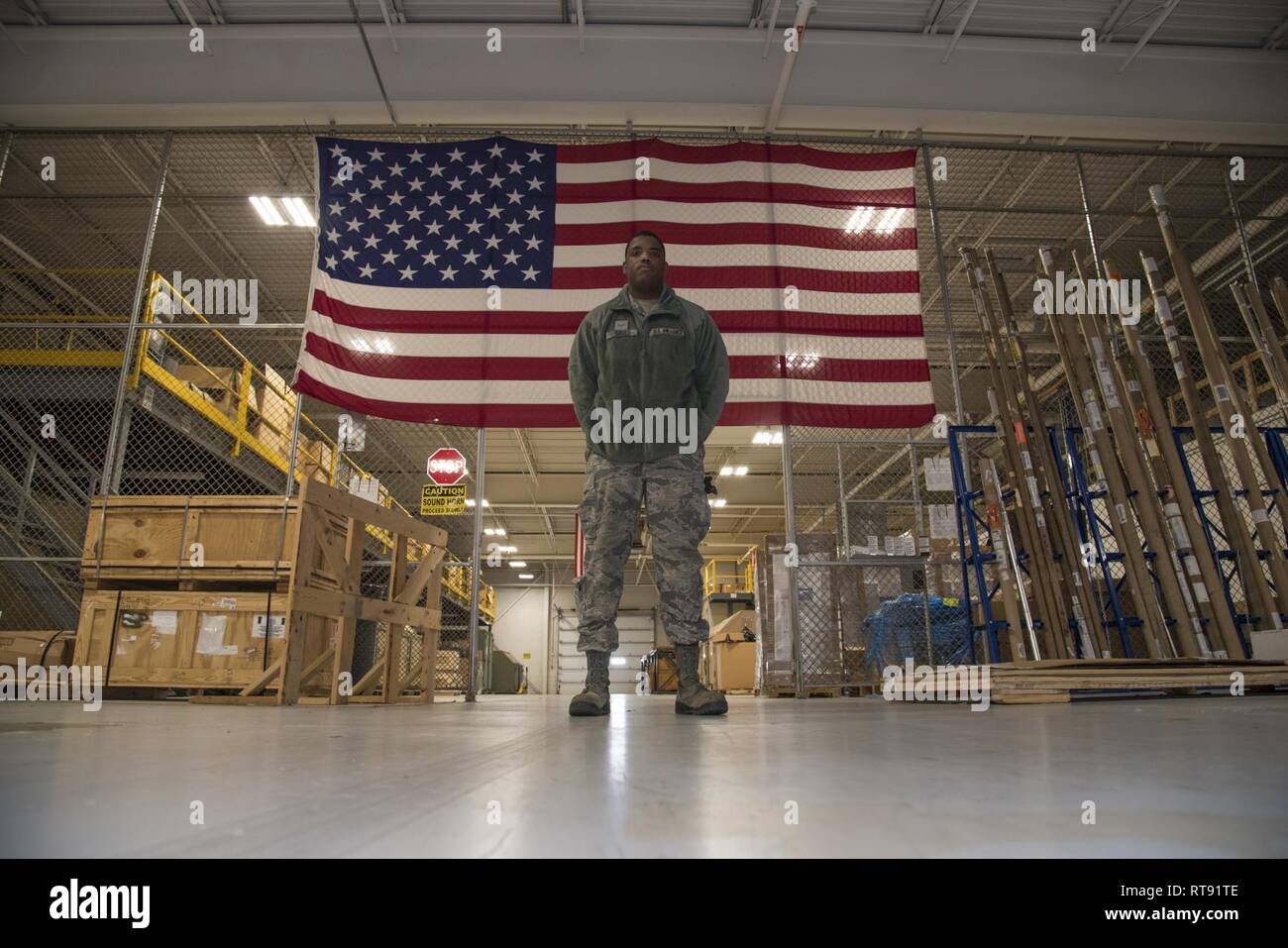 Airman Anthony Lemarc Cole Jr., a traffic management specialist, 108th Logistics Readiness Squadron, poses for a photo in the LRS supply warehouse at Joint Base McGuire-Dix-Lakehurst, N.J., Feb. 4, 2019. As a TMO specialist, Cole's duties include packaging, classifying, and arranging personal property and cargo for shipment or storage across the globe via air, ground, rail & vessel transportation. Stock Photo