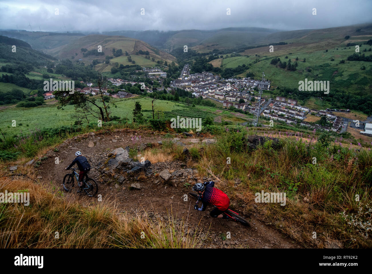 Two men ride mountain bikes on a trail at Glyncorrwg in Neath Port