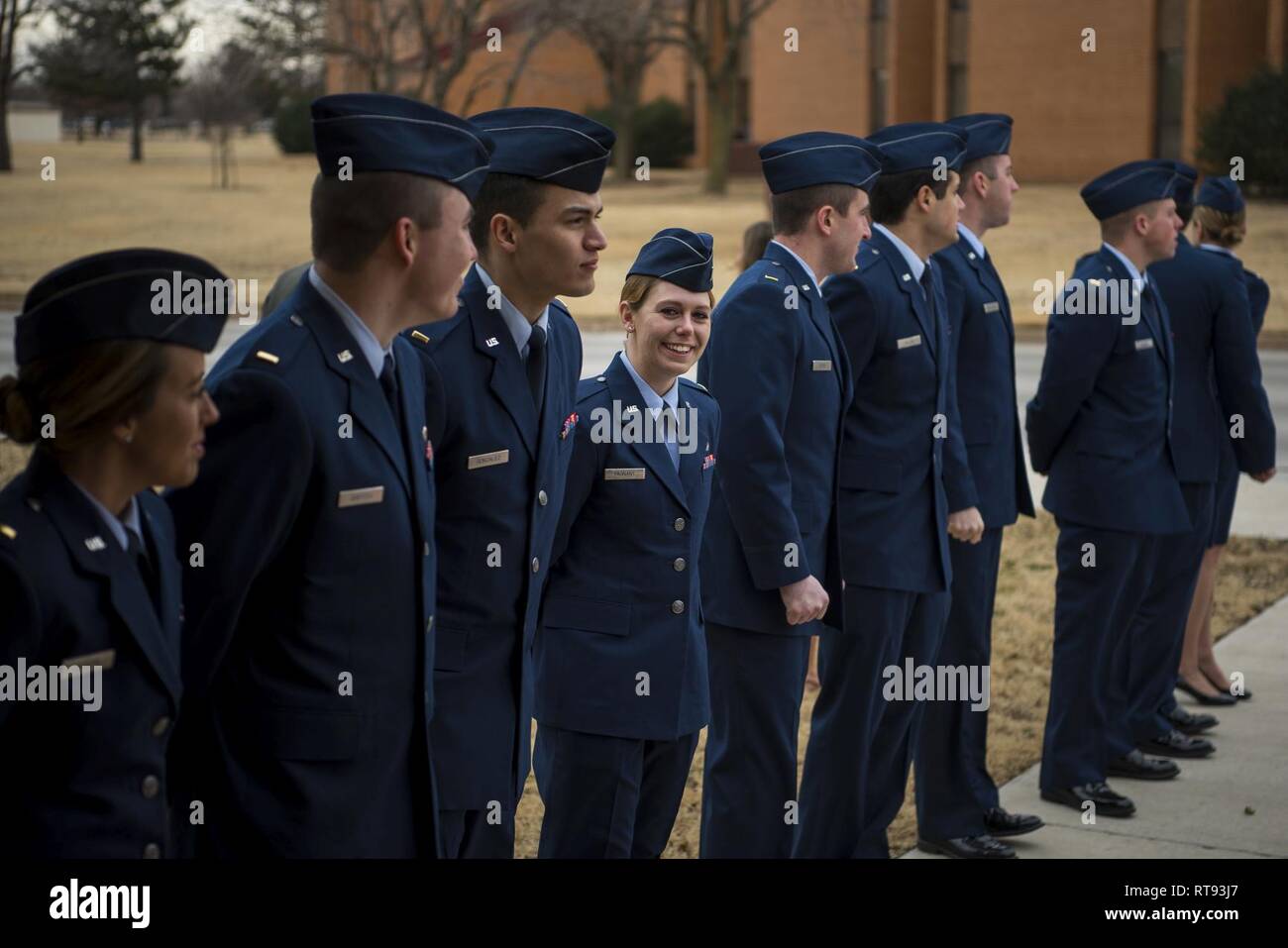 (Center) 2nd Lt. Morgan Fagnant, a pilots assigned to the 71st Student Squadron, stands alongside her fellow student pilots of class 19-04 Jan. 25, outside of the base theater on Vance Air Force Base, Oklahoma. It is tradition for graduates to stand in two lines outside of the base theater before the ceremony starts. Stock Photo