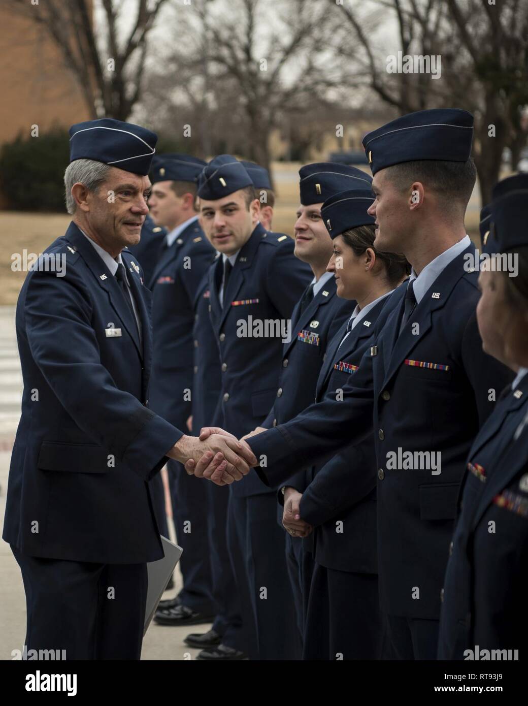 Retired Brig. Gen. Kevin J. Keehn, was the commander of New Jersey Air National Guard, shakes hands with a student pilot Jan. 25, at the graduation ceremony held at Vance Air Force Base, Oklahoma. Keehn was the guest speaker for Undergraduate Pilot Training Class 19-04’s graduation ceremony. Stock Photo