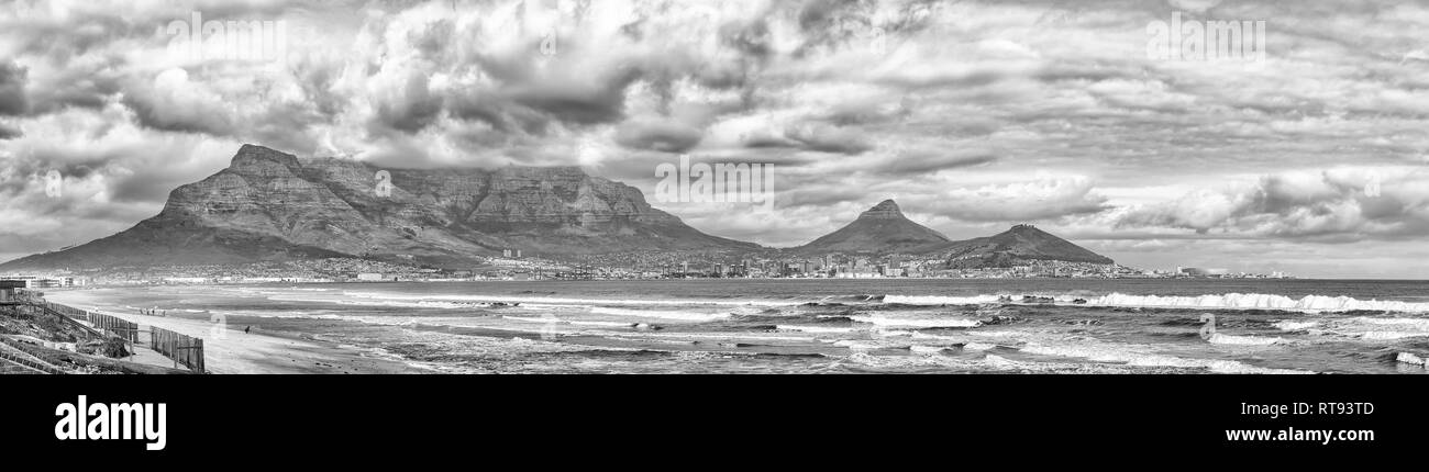 CAPE TOWN, SOUTH AFRICA, AUGUST 14, 2018: A view of Cape Town as seen from Milnerton Beach. The Central Business District, harbor, Devils Peak, Table  Stock Photo