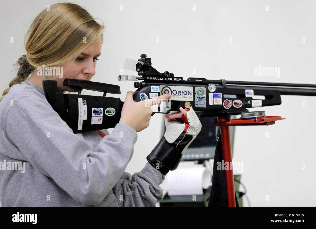 Mackayla Bourgeois, a junior sporter competitor at the U.S. Army Junior Rifle National Championships at Fort Benning, Georgia, prepares for her next shot in the relay on January 25, 2019. The three-day, invitation-only event had the youth athletes compete side by side for top individual and team honors in three-position smallbore, sporter rifle and precision rifle. Bourgeois made the Sporter Finals, which include the top eight scores from the relays, both days of the competition. Stock Photo