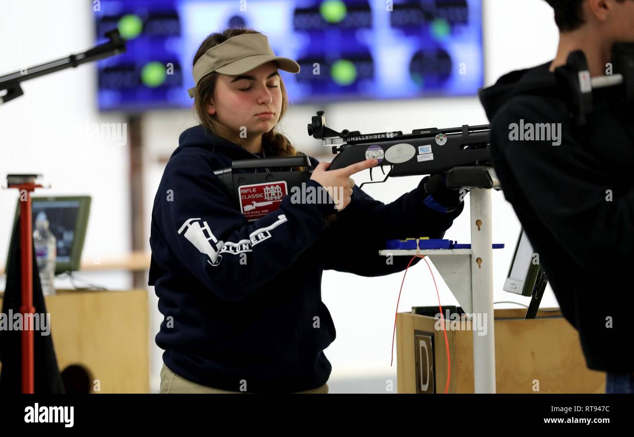 Olivia Cattrell from Church Hill, Tennesse, takes a calming breath during the Day 1 Sporter Finals at the U.S. Army Junior Rifle National Championships at Fort Benning, Georgia on January 25, 2019. The three-day, invitation-only event had the youth athletes compete side by side for top individual and team honors in three-position smallbore, sporter rifle and precision rifle. At the end of the competition, Cattrell placed third overall in the individual Sporter Class, with a score of 1118 and 39X. Stock Photo