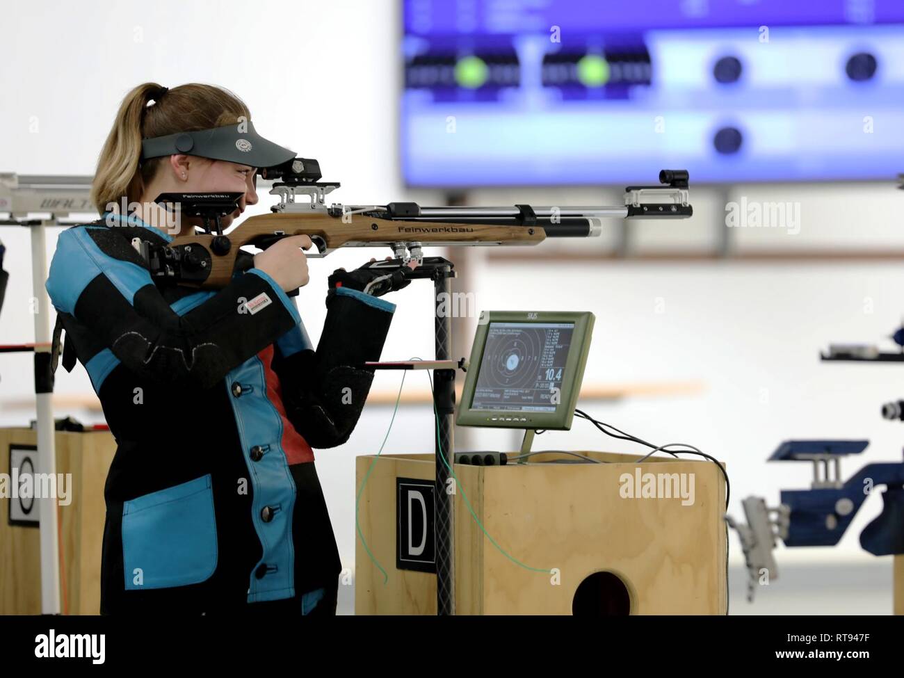 Macy Way with NTCSC-Citius from Colorado Springs, Colorado fires her rifle during the Day 1 Precision Finals at the U.S. Army Junior Rifle National Championships at Fort Benning, Georgia January 25, 2019. The three-day, invitation-only event had the youth athletes compete side by side for top individual and team honors in three-position smallbore, sporter rifle and precision rifle. Way won the Day 1 Precision Finals and her team placed second overall. Stock Photo