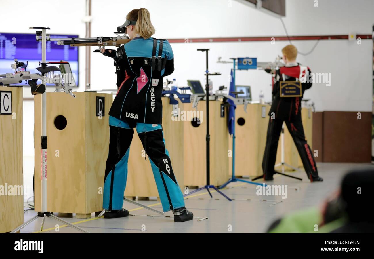 Macy Way from NTCSC-Citius from Colorado Springs, Colorado, and Scott Rockett from Hampton, Virginia, fire their last shots during the Precision Finals at the U.S. Army Junior Rifle National Championships at Fort Benning, Georgia January 25, 2019. The three-day, invitation-only event had the youth athletes competing side by side for top individual and team honors in three-position smallbore, sporter rifle and precision rifle. Way won the Day 1 Precision Final and Rockett placed second in the overall individual Precision Class. Stock Photo