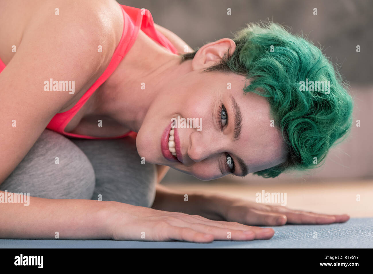 Beautiful woman feeling joyful while stretching her body Stock Photo