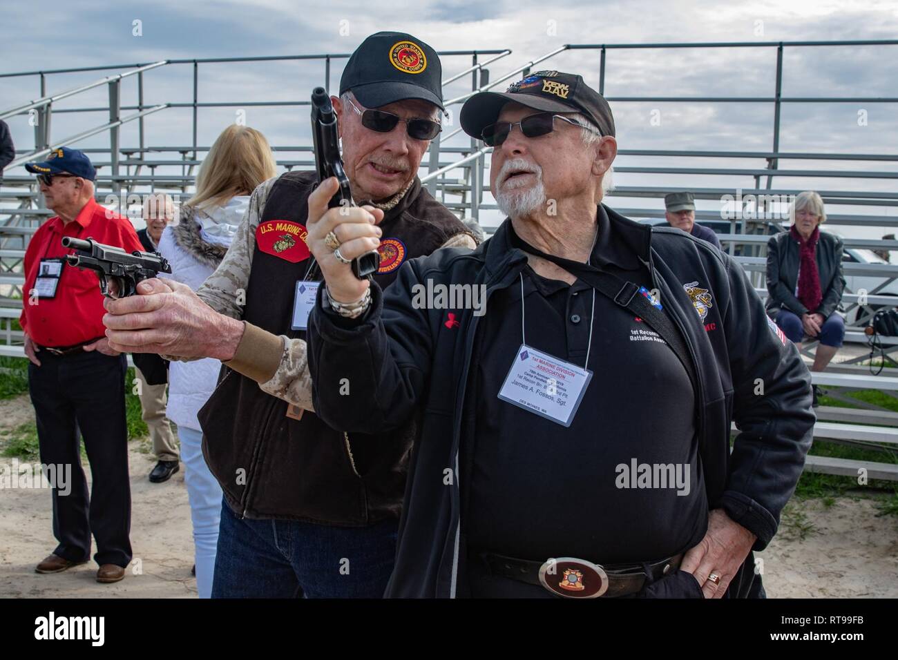 U.S. Marine Corps veterans Ted Draper, left, and James Fossos examine ...