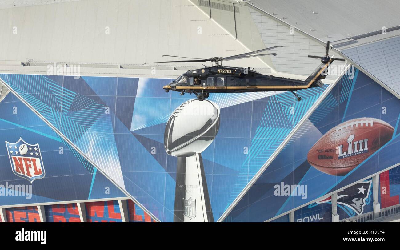 The hand of St. Louis Rams Roland Williams sports two Super Bowl rings as  he takes video at Media Day for Super Bowl XLI at Dolphins Stadium in Miami  on January 30