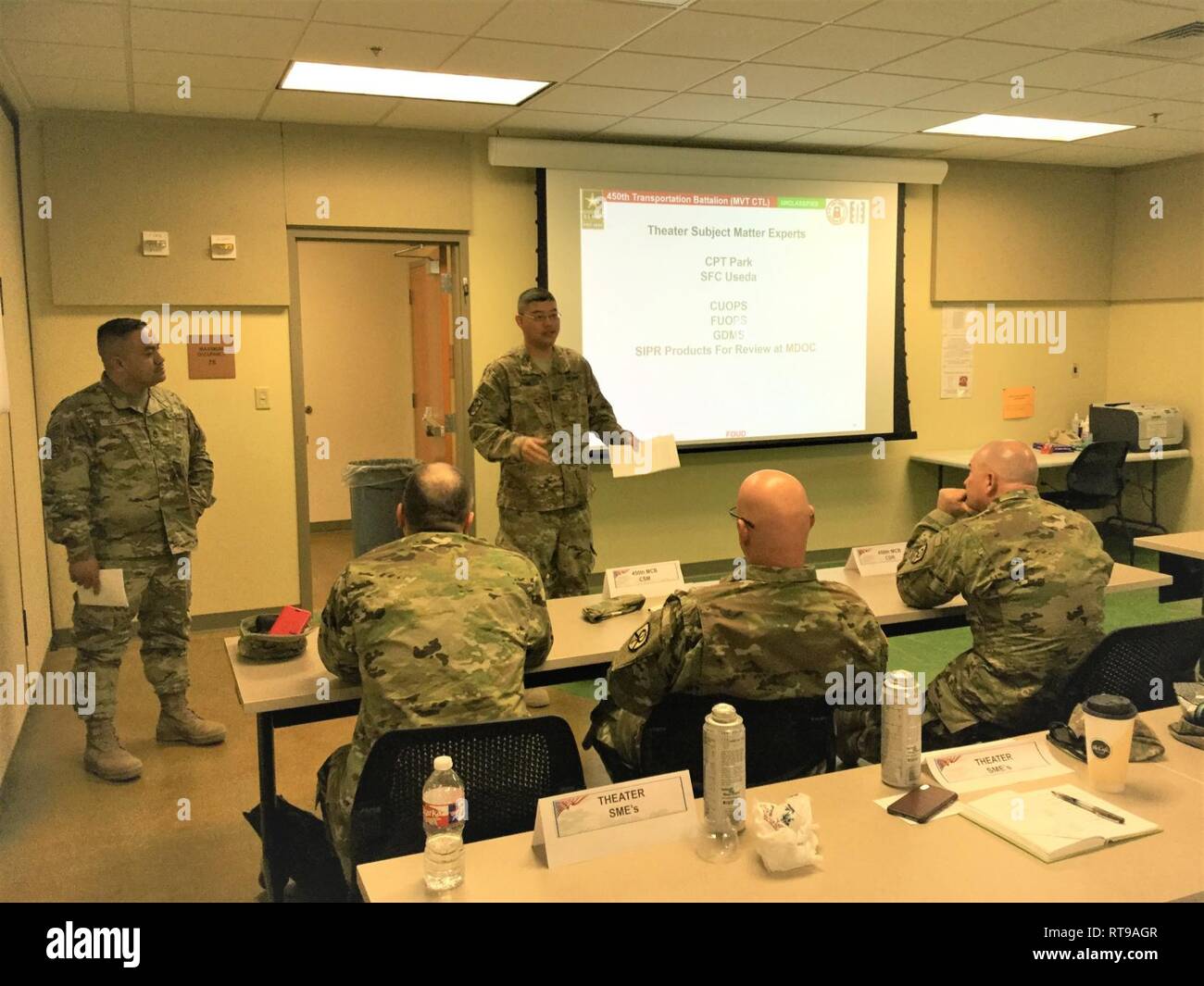 Capt. Joseph Park and Sgt. 1st Class Damian Useda, 420th Movement Control Battalion, brief the 450th Movement Control Battalion (MCB) command team during the 450th MCB final planning conference at Fort Hood, Texas, Jan. 30, 2019. Stock Photo