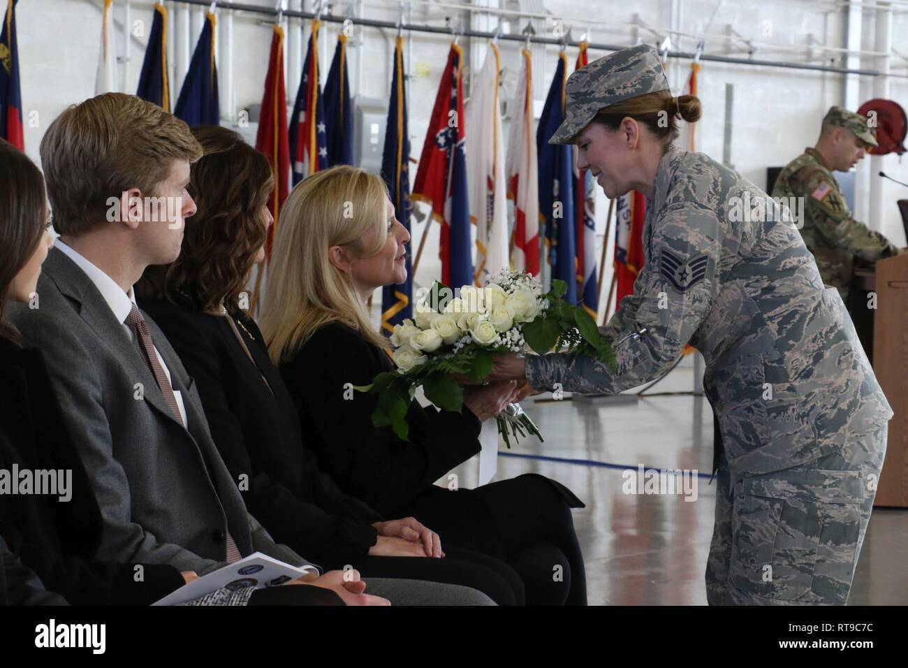 Air National Guard Staff Sgt. Patricia Ford presents Mrs. Marty Kemp with a bouquet of white roses during the Georgia National Guard change of command ceremony on Clay National Guard Center January 26, 2019. White is the color of Mrs. Kemp’s new beginning as the First Lady of the state of Georgia. U.S. Army National Guard Stock Photo