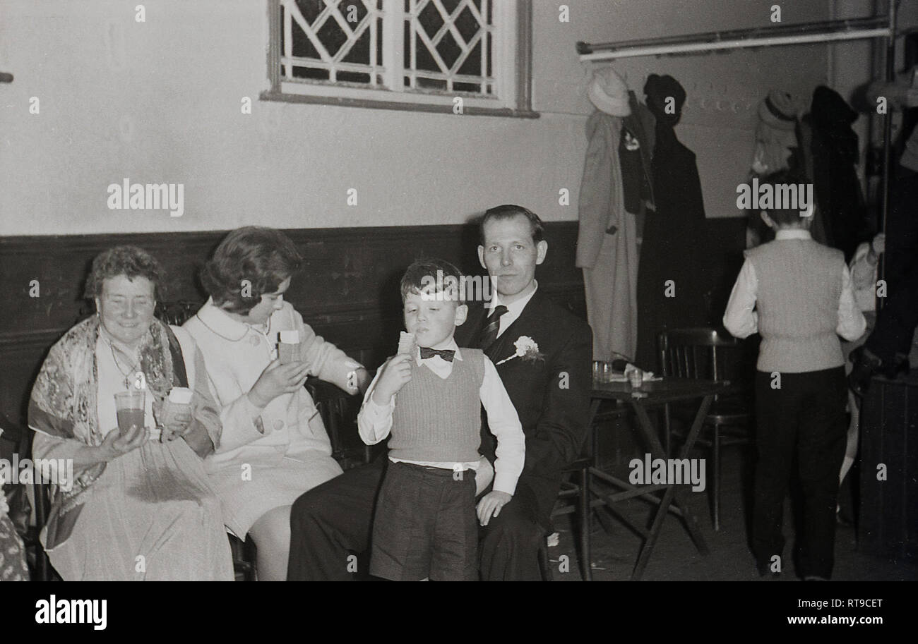 1950s A Family At A Wedding Reception Sitting In A Church Hall