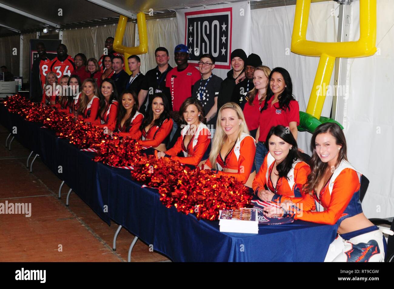 The USO hosts the Denver Broncos cheerleaders, mascot and Alumni football players for a meet and greet with lots of laughs, autographs, smiles and selfies with Soldiers of the 1st Armored Brigade Combat Team, 1st Cavalry Division at Camp Aachen's USO annex in Grafenwoehr, Germany, Jan. 26, 2019. IRONHORSE deployed in support of Atlantic Resolve, an enduring exercise to improve interoperability between U.S. Forces, their NATO allies and partners. Stock Photo