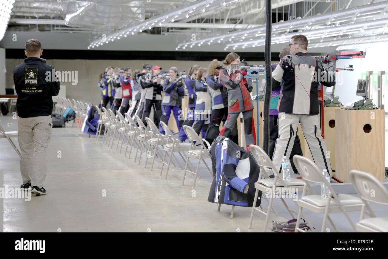 U.S. Army Pfc. Jared Desrosiers, a Swansea, Massachusetts native who serves on the U.S. Army Marksmanship Unit’s International Rifle Team, watch over competitors at the U.S. Army Junior Rifle National Championships at Fort Benning, Georgia January 26, 2019. The three-day, invitation-only event had the youth athletes compete side by side for top individual and team honors in three-position smallbore, sporter rifle and precision rifle. Stock Photo