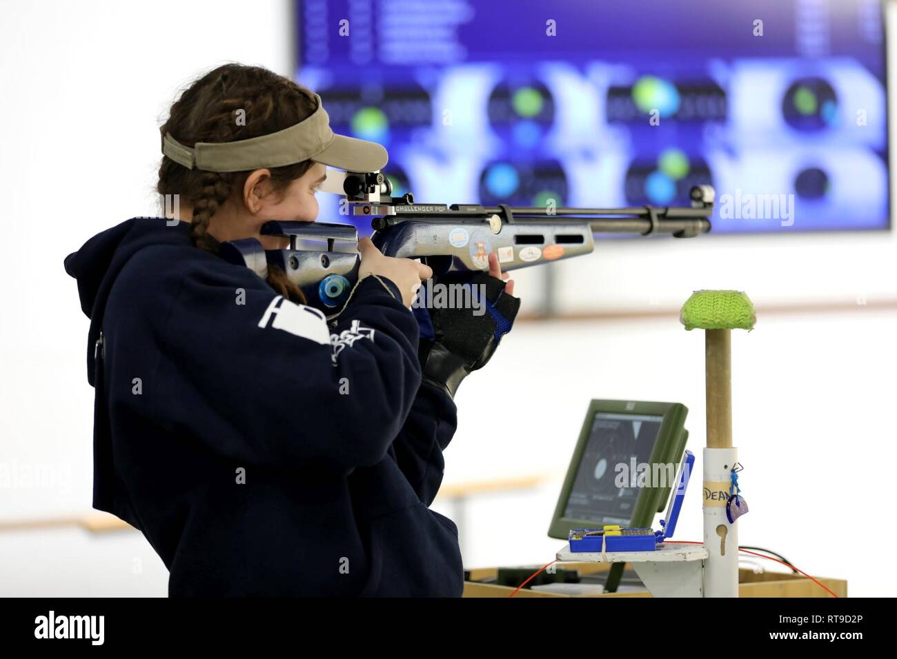 Jaden-Ann Fraser from Church Hill, Tennessee, fires her rifle at the Day 2 Sporter Finals during the U.S. Army Junior Rifle National Championships at Fort Benning, Georgia January 25, 2019. The three-day, invitation-only event had the youth athletes compete side by side for top individual and team honors in three-position smallbore, sporter rifle and precision rifle. At the end of the competition, Fraser placed second in the overall individual Sporter Class with a score of 1121 and 35X. Stock Photo