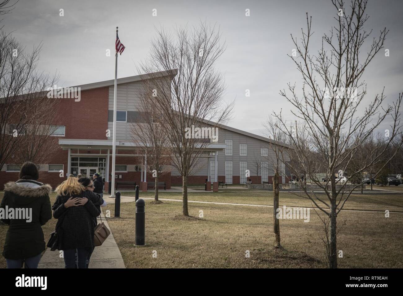 Family members spend their last few moments with their Soldiers after a