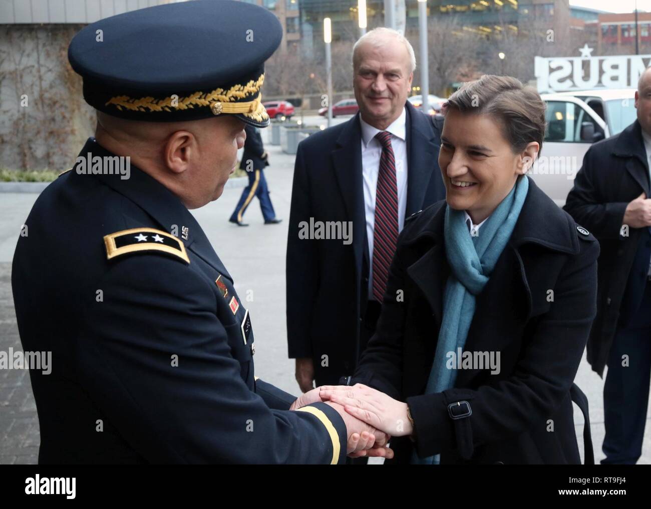 Serbian Prime Minister Ana Brnabić says goodbye to Maj. Gen. John C. Harris Jr., Ohio adjutant general, while Serbian Ambassador to the U.S. Djerdj Matković looks on, Jan. 28, 2019 in Columbus, Ohio. Brnabić and Matković met with Ohio military, political, academic and business leaders to promote mutual relations and to discuss areas of economic cooperation. Stock Photo