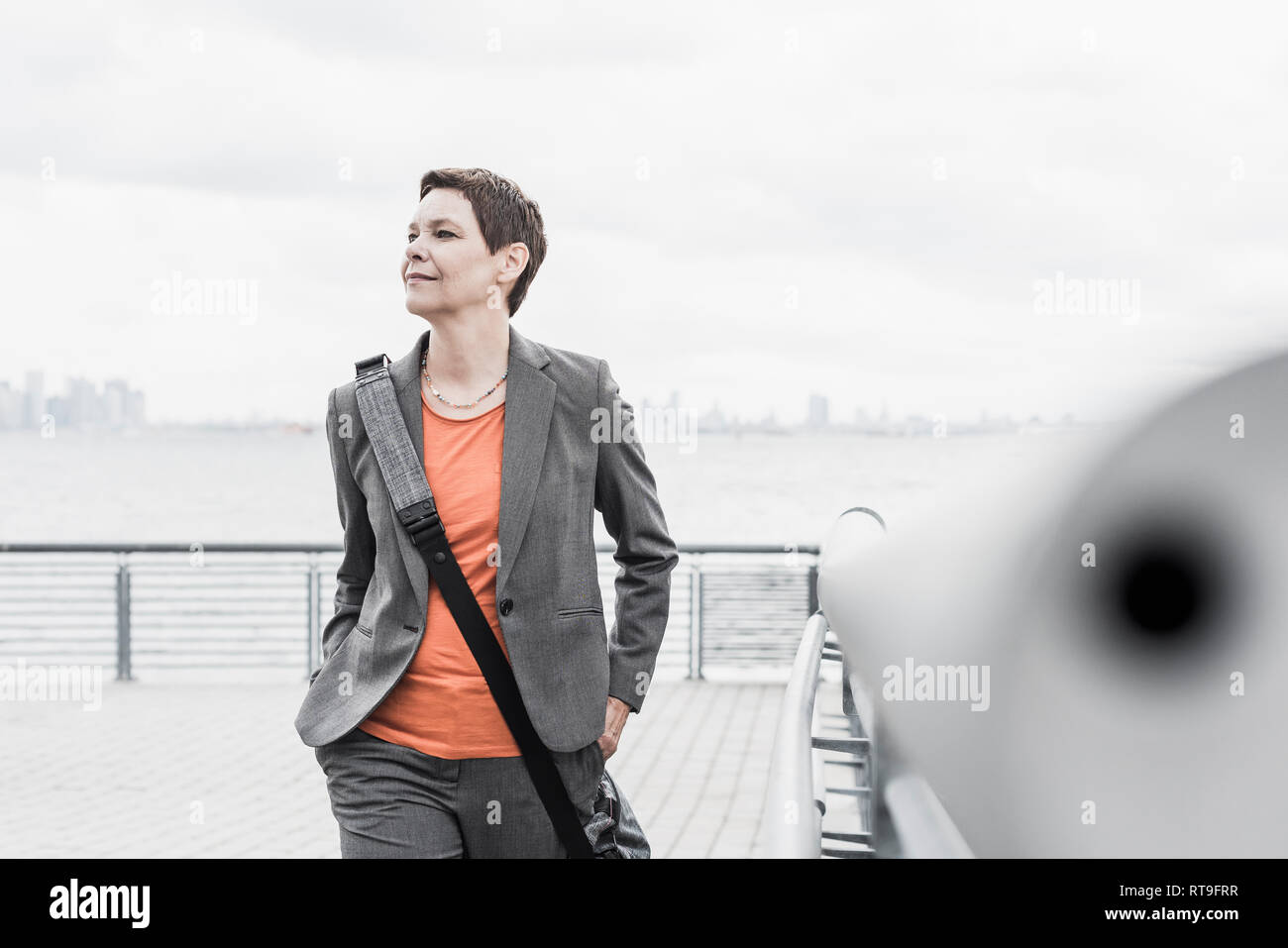 Businesswoman on a ferry Stock Photo