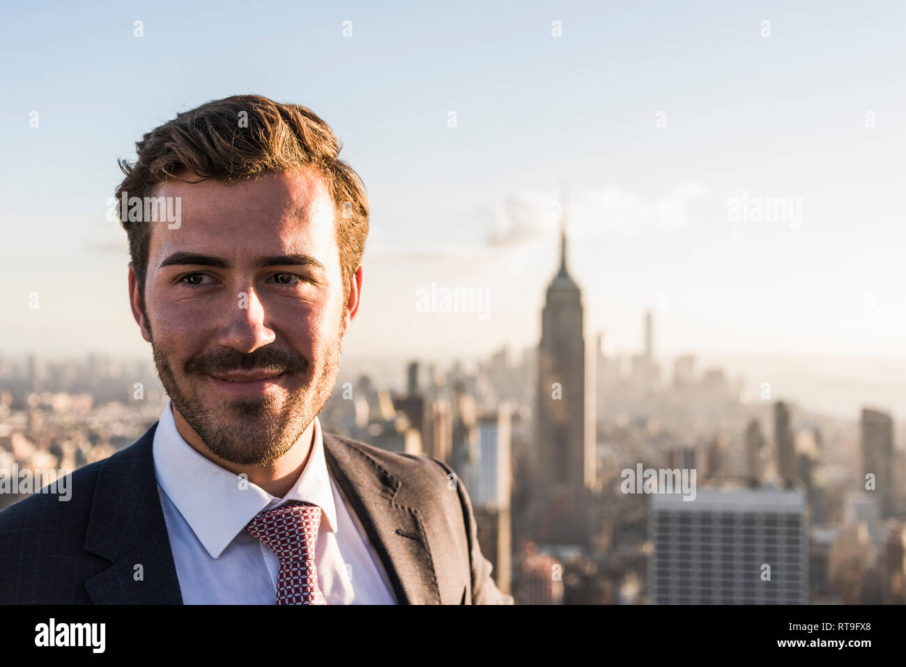 USA, New York City, smiling businessman on Rockefeller Center observation deck Stock Photo