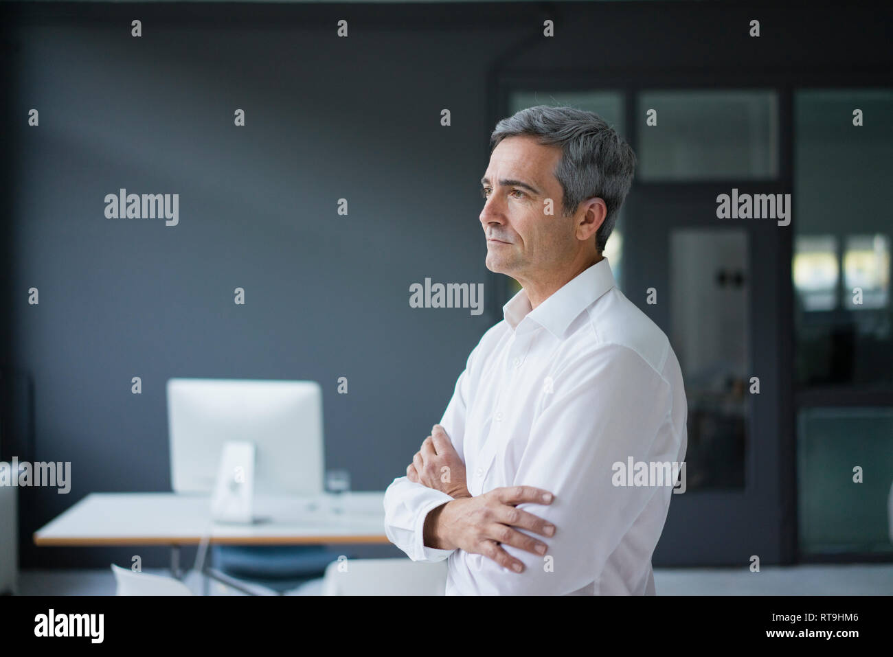 Businessman in the office thinking Stock Photo