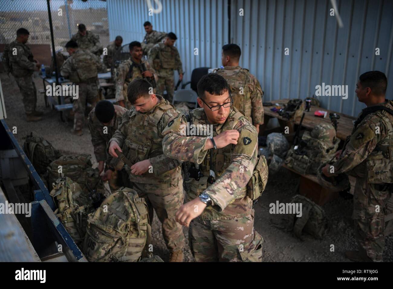 U.S. Soldiers with Delta Company, 1st Battalion, 141st Infantry Regiment (1-141 IN), Texas Army National Guard, deployed in support of Combined Joint Task Force - Horn of Africa (CJTF-HOA), prepare personal equipment in the reaction force compound on Camp Lemonnier, Djibouti, Jan. 29, 2019. The mission of the 1-141 IN is to rapidly deploy in response to any crisis threatening U.S. personnel or property throughout CJTF-HOA, and to contribute to international efforts to enhance security and stability in East Africa by providing security force assistance and fostering the capabilities of partner  Stock Photo