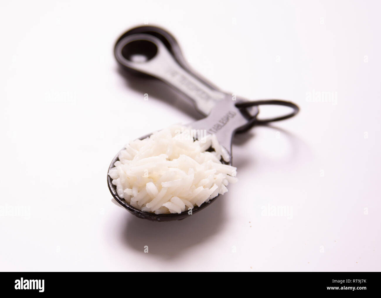 One tablespoon of food. Portion control. White basmati rice Stock Photo ...