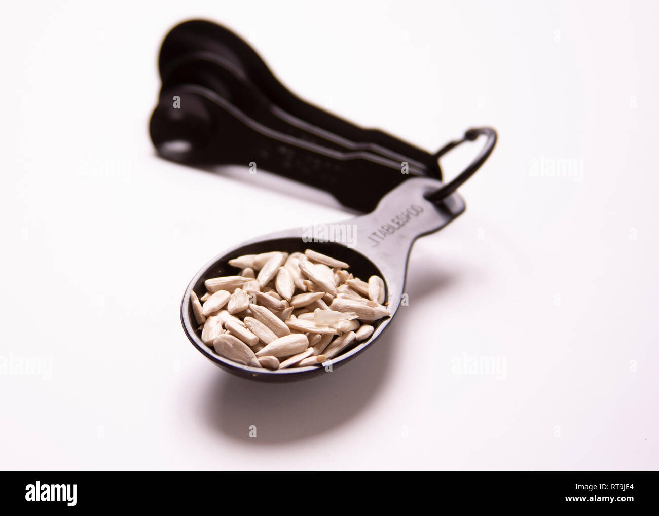 One tablespoon of food. Portion control. Sunflower seeds Stock Photo