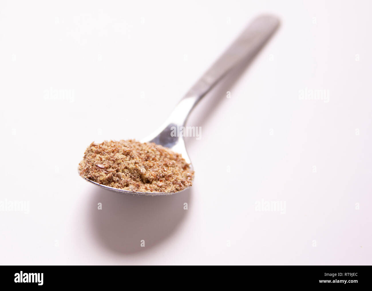 One tablespoon of food. Portion control. Ground flaxseed Stock Photo