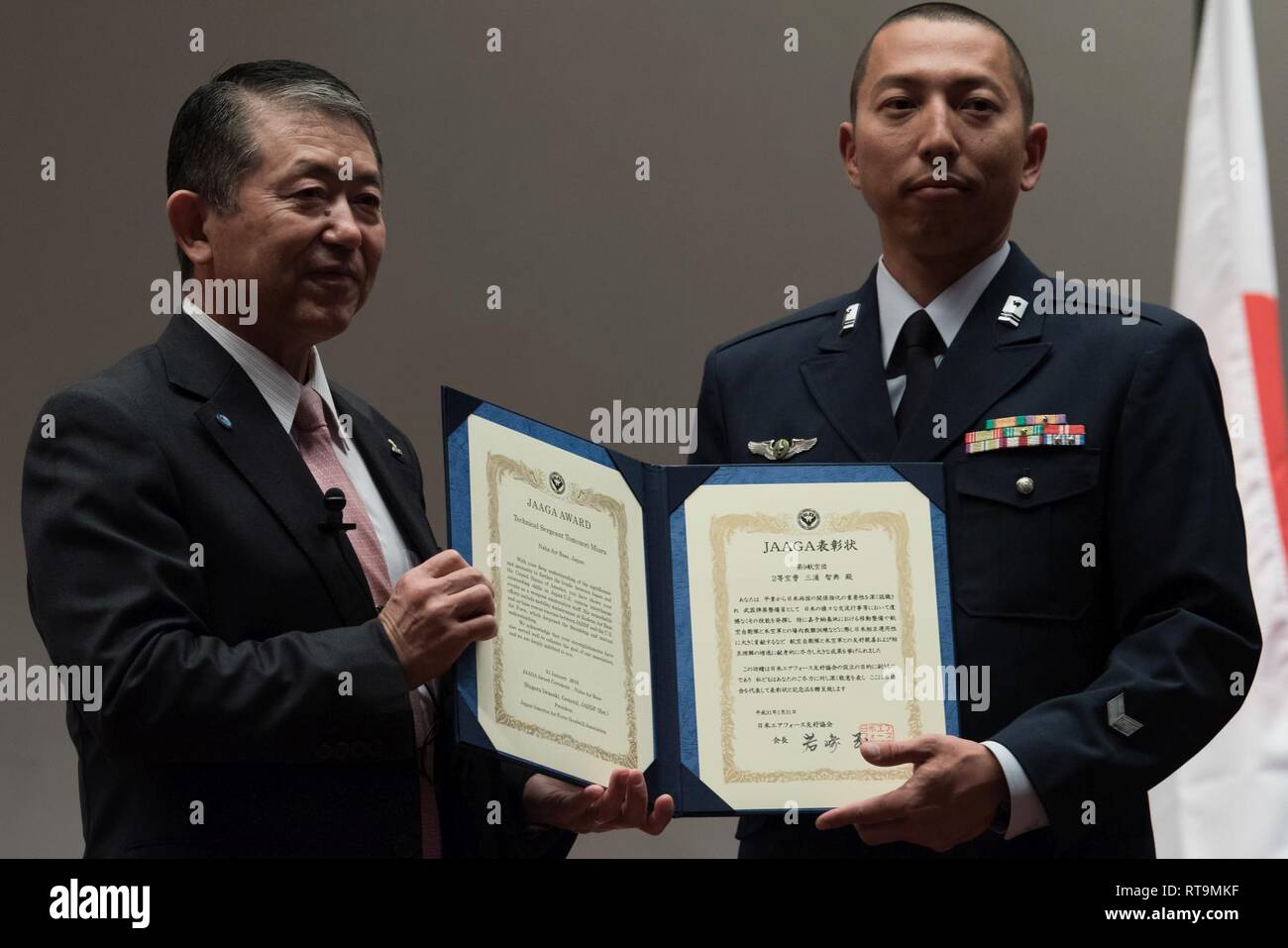 Japan Air Self-Defense Force Tech. Sgt. Tomonori Miura, 9th Air Wing Armament Maintenance Squadron munitions troop, receives an award from Mr. Shigeru Iwasaki, Japan-America Air Force Goodwill Association president, during the 2018 JAAGA Awards Ceremony January 31, 2019, at Naha Air Base, Japan. Miura was recognized for his outstanding skills as a munitions troop.  During a bilateral exchange, Miura learned about mobility maintenance at Kadena Air Base and participated in a bilateral exercise. Stock Photo