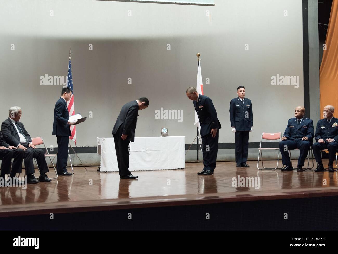 Japan Air Self-Defense Force Tech. Sgt. Tomonori Miura, 9th Air Wing Armament Maintenance Squadron munitions troop, thanks Mr. Shigeru Iwasaki, Japan-America Air Force Goodwill Association president, after receiving an award during the 2018 JAAGA Awards Ceremony January 31, 2019, at Naha Air Base, Japan. Miura was recognized for his outstanding skills as a munitions troop. During a bilateral exchange, Miura learned about mobility maintenance at Kadena Air Base and participated in a bilateral exercise. Stock Photo