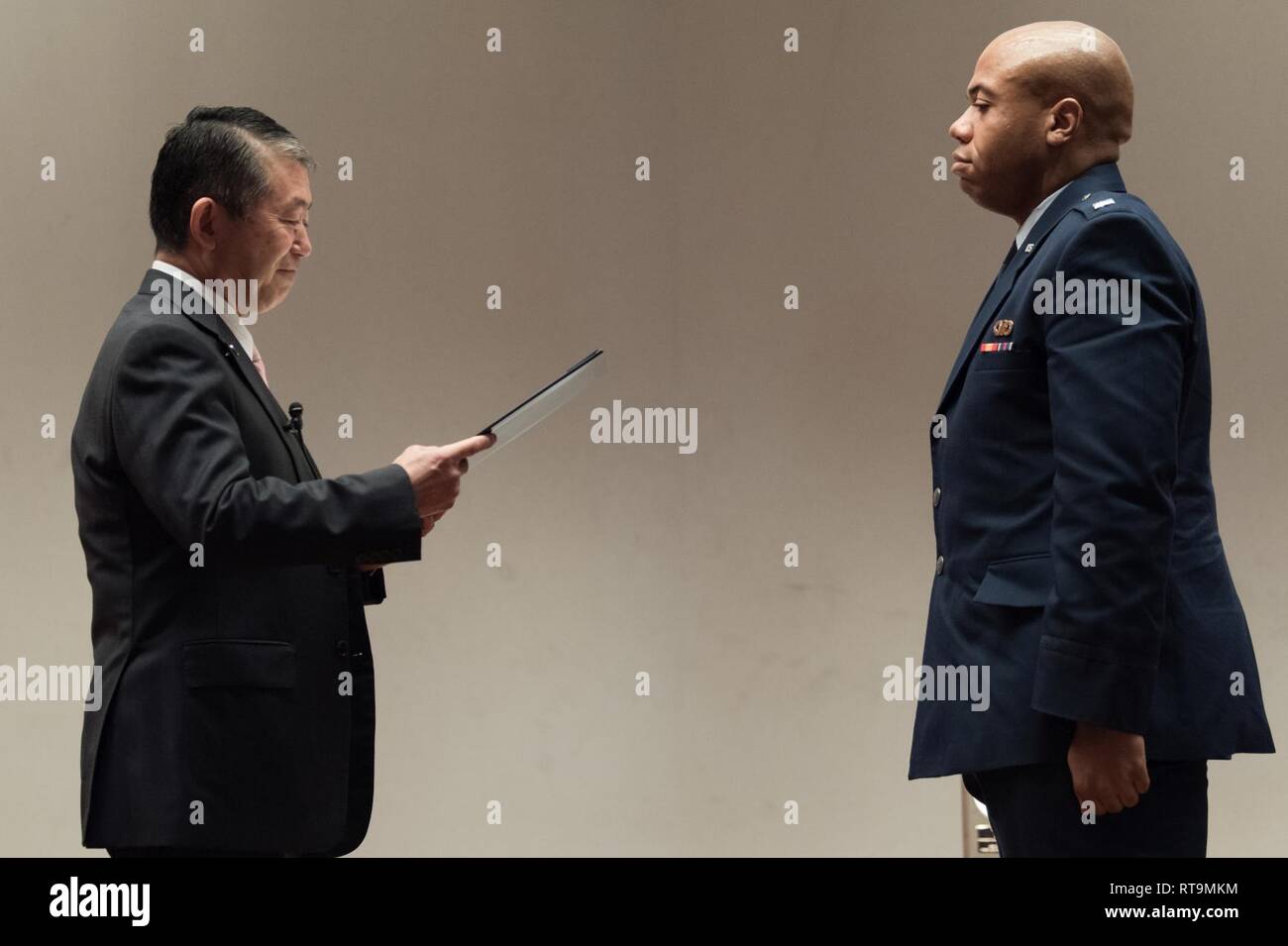 U.S. Air Force 1st Lt. Antoinio Arnold, 18th Operation Support Squadron chief of intel readiness, receives an award from Mr. Shigeru Iwasaki, Japan-America Air Force Goodwill Association president, during the 2018 JAAGA Awards Ceremony January 31, 2019, at Naha Air Base, Japan. Arnold was recognized for his outstanding skills in a Japan-U.S. defense conference, the Bilateral Leadership Officer Group and the Koku-Jieitai English Competition. Stock Photo