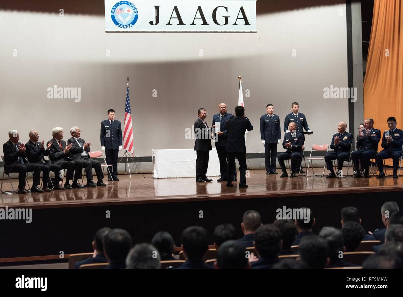 U.S. Air Force 1st Lt. Antoinio Arnold, 18th Operation Support Squadron chief of intel readiness, receives an award from Mr. Shigeru Iwasaki, Japan-America Air Force Goodwill Association president, during the 2018 JAAGA Awards Ceremony January 31, 2019, at Naha Air Base, Japan. Arnold was recognized for his outstanding skills in a Japan-U.S. defense conference, the Bilateral Leadership Officer Group and the Koku-Jieitai English Competition. Stock Photo