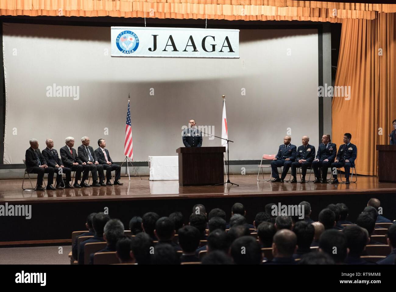 Japan Air Self-Defense Force Tech. Sgt. Tomonori Miura, 9th Air Wing Armament Maintenance Squadron munitions troop, delivers a speech during the 2018 JAAGA Awards Ceremony January 31, 2019, at Naha Air Base, Japan. Miura was recognized for his outstanding skills as a munitions troop. During a bilateral exchange, Miura learned about mobility maintenance at Kadena Air Base and participated in a bilateral exercise. Stock Photo