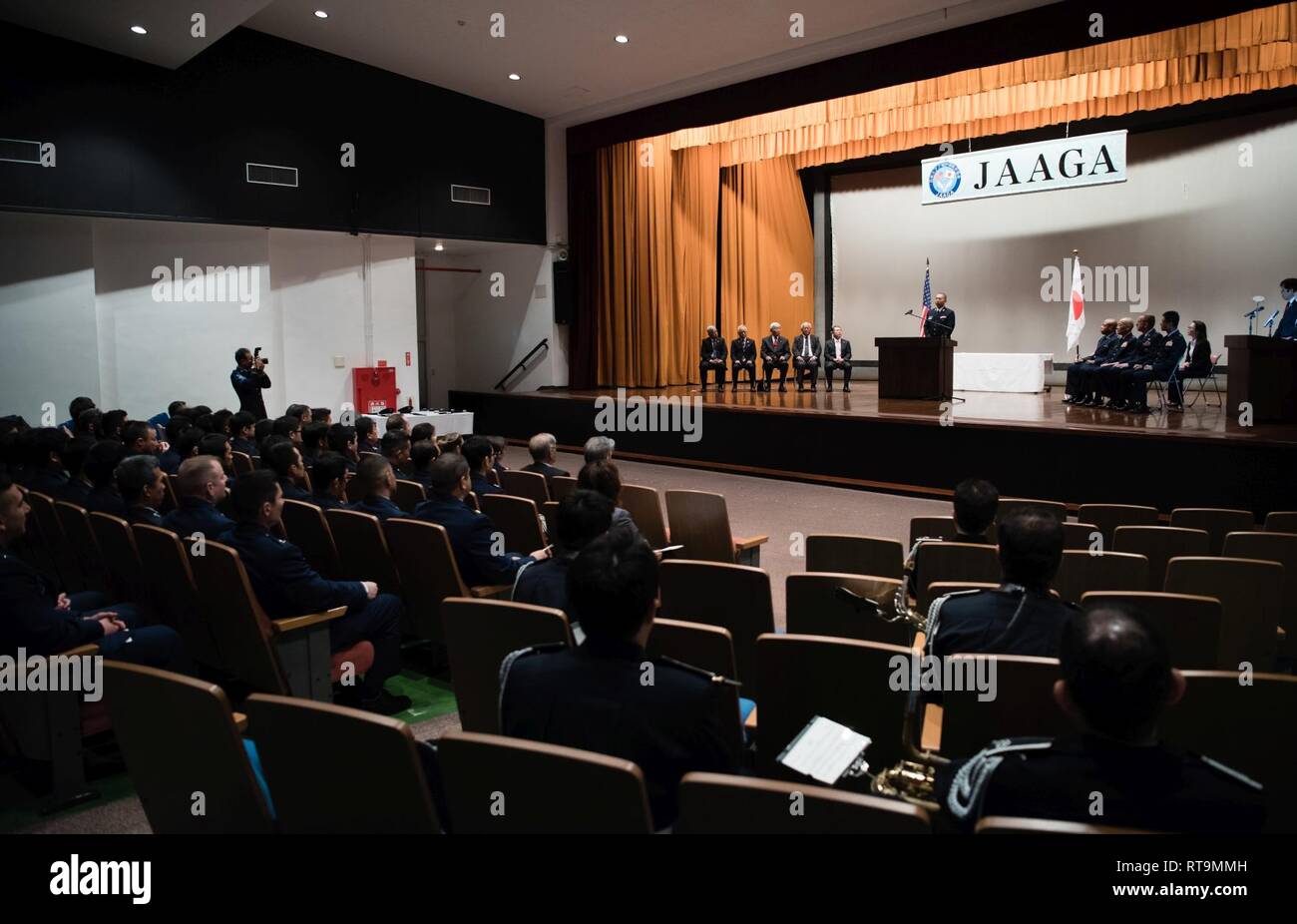 Japan Air Self-Defense Force Tech. Sgt. Tomonori Miura, 9th Air Wing Armament Maintenance Squadron munitions troop, delivers a speech during the 2018 JAAGA Awards Ceremony January 31, 2019, at Naha Air Base, Japan. Miura was recognized for his outstanding skills as a munitions troop. During a bilateral exchange, Miura learned about mobility maintenance at Kadena Air Base and participated in a bilateral exercise. Stock Photo