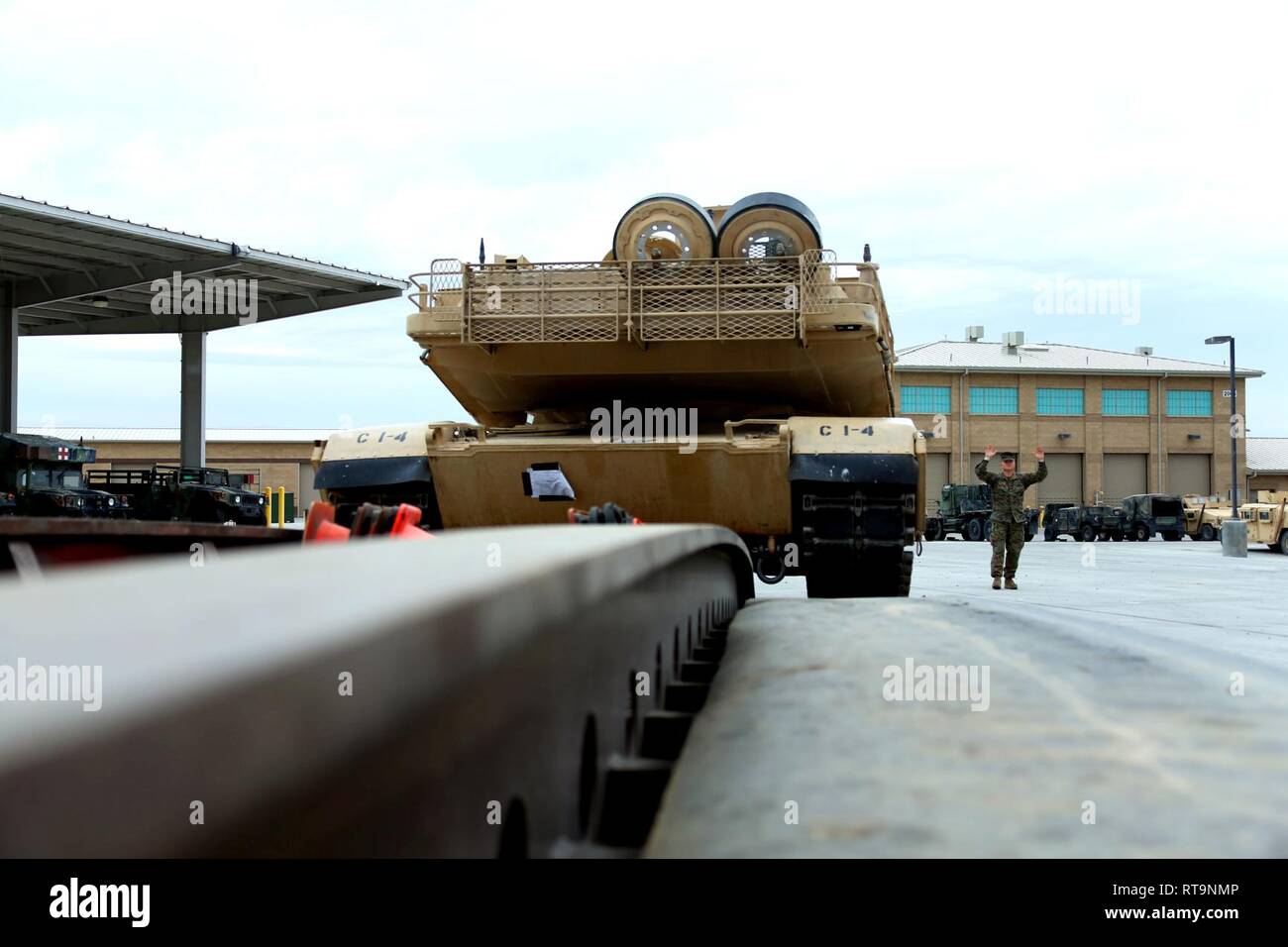 A U.S. Marine with 1st Tank Battalion, 1st Marine Division, directs