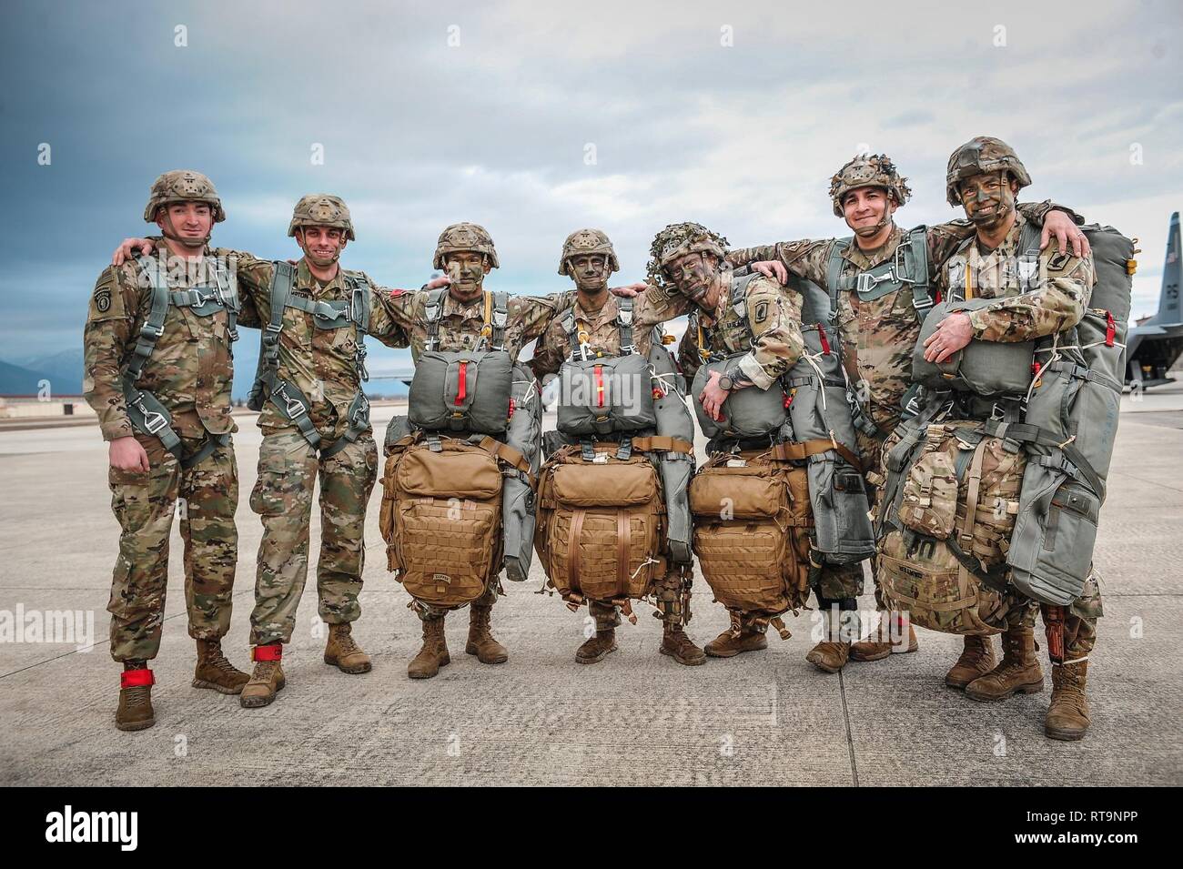 Jumpmasters assigned to Bravo Company, 54th Brigade Engineer Battalion, 173rd Airborne Brigade, embrace the spirit of the Airborne before a night jump on January 31, 2019. Stock Photo