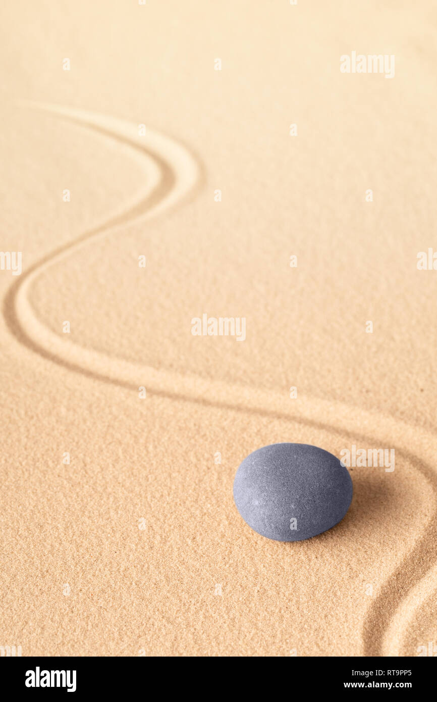 zen meditation or yoga background with blue round stone for focus and concentration for spiritual balance harmony and purity. Stock Photo