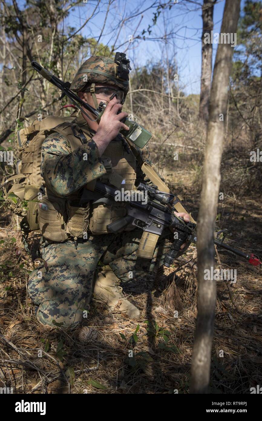 U.S. Marine Sgt. Liam Lynch, an infantry Marine, communicates on a AN ...