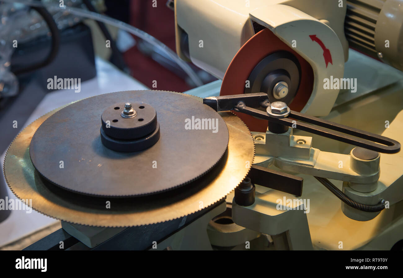 Circular carbide saw blade sharpener grinding machine Stock Photo - Alamy