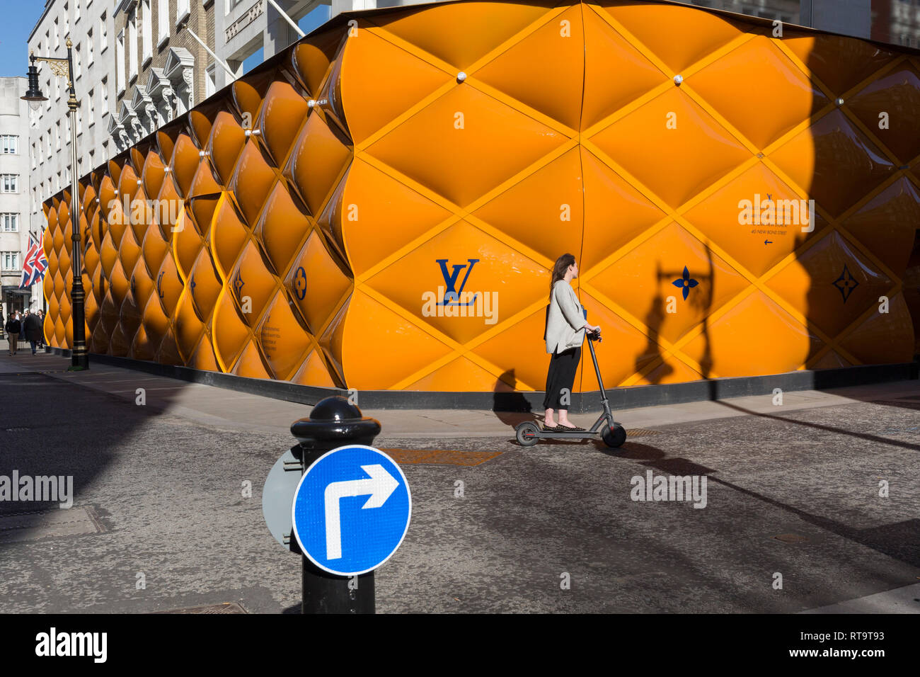 Passers-by and the temporary renovation hoarding of luxury brand Louis  Vuitton in New Bond Street, on 25th February 2019, in London, England Stock  Photo - Alamy