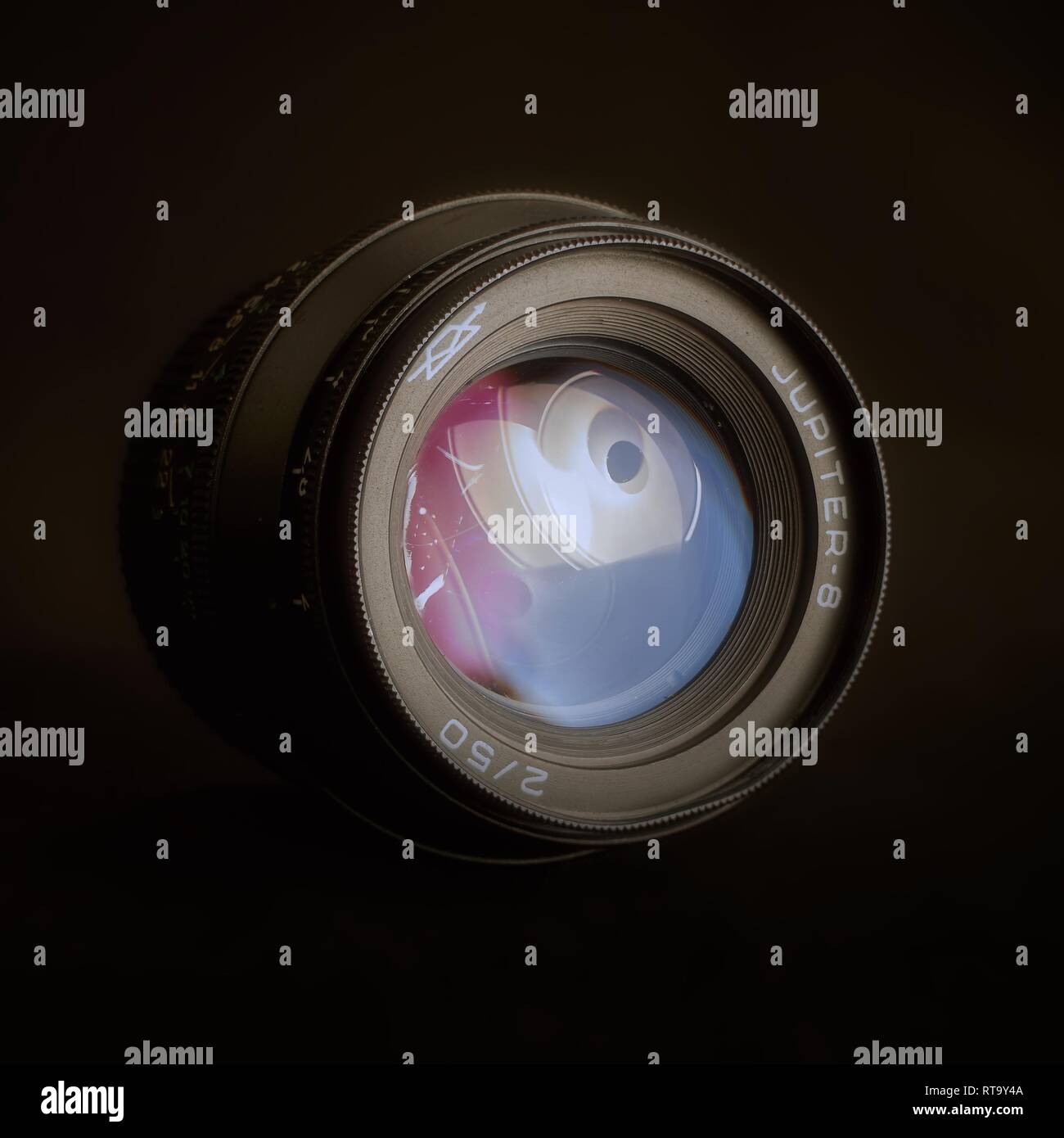 Essex, UK - 2/28/2019 : Russian manufactured Jupiter 8 50mm lens with a Leica M39 mount against a dark background. Stock Photo