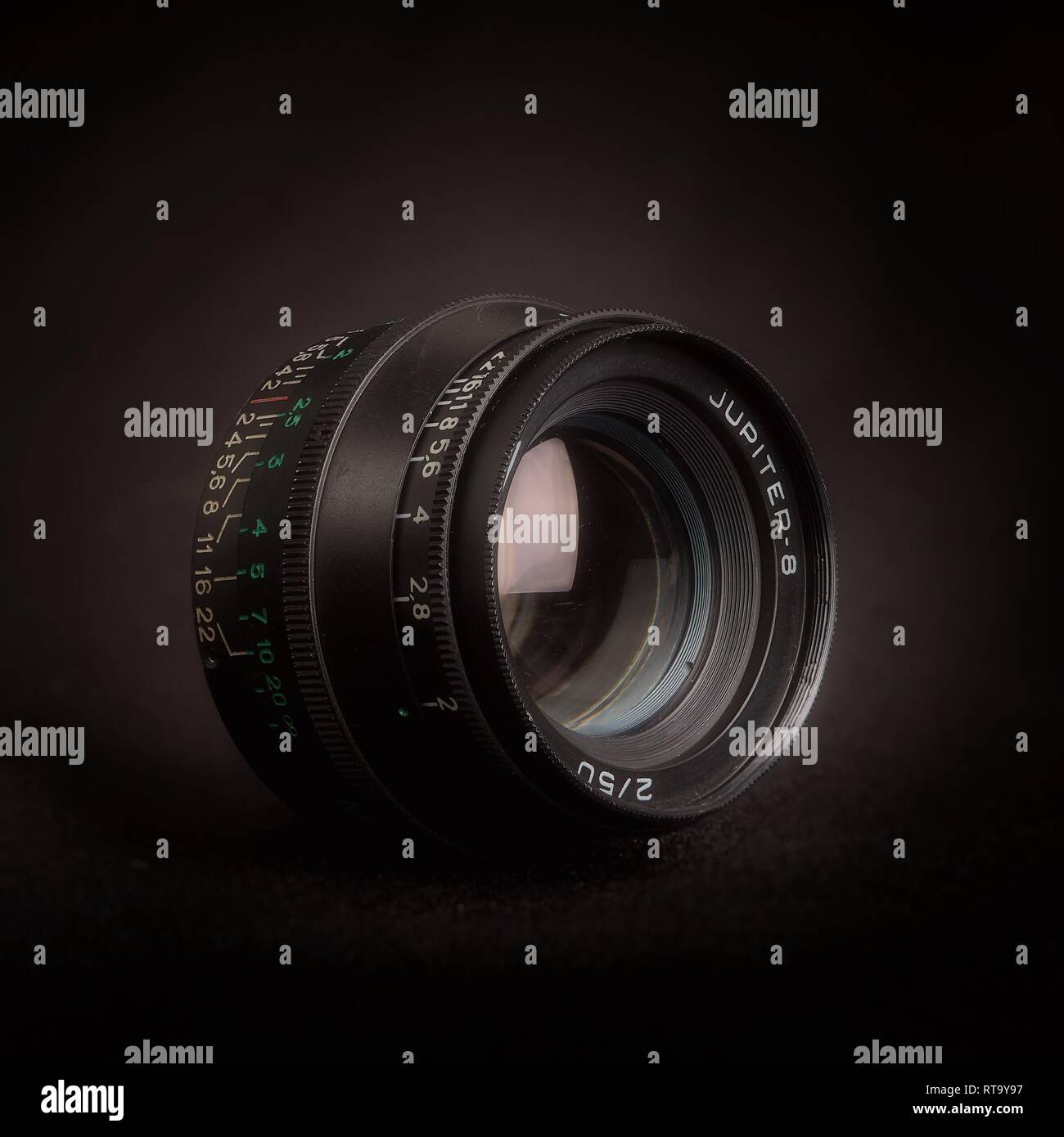 Essex, UK - 2/28/2019 : Russian manufactured 50mm Jupiter 8 lens with an M39 mount against a dark background. Stock Photo