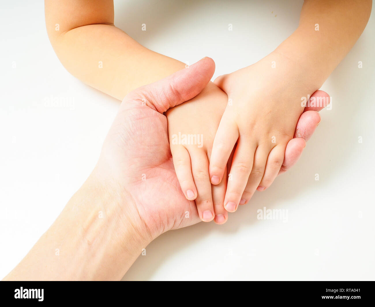 Big And Small Hands Stock Photo - Download Image Now - Adult