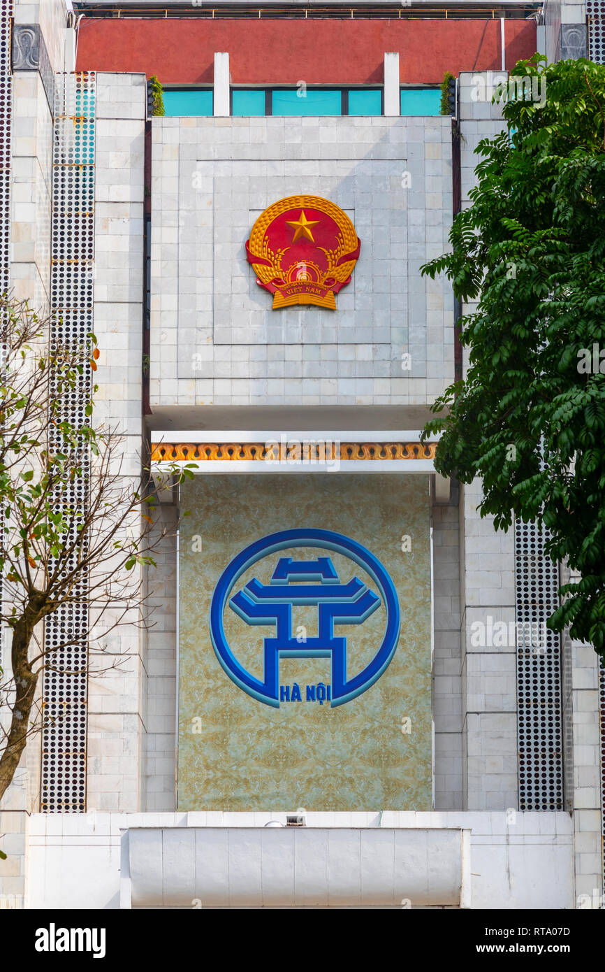 traditional symbols for Vietnam (top) and the icon for the city of Hanoi (bottom), on the outside of the local government offices, Hanoi, Vietnam Stock Photo