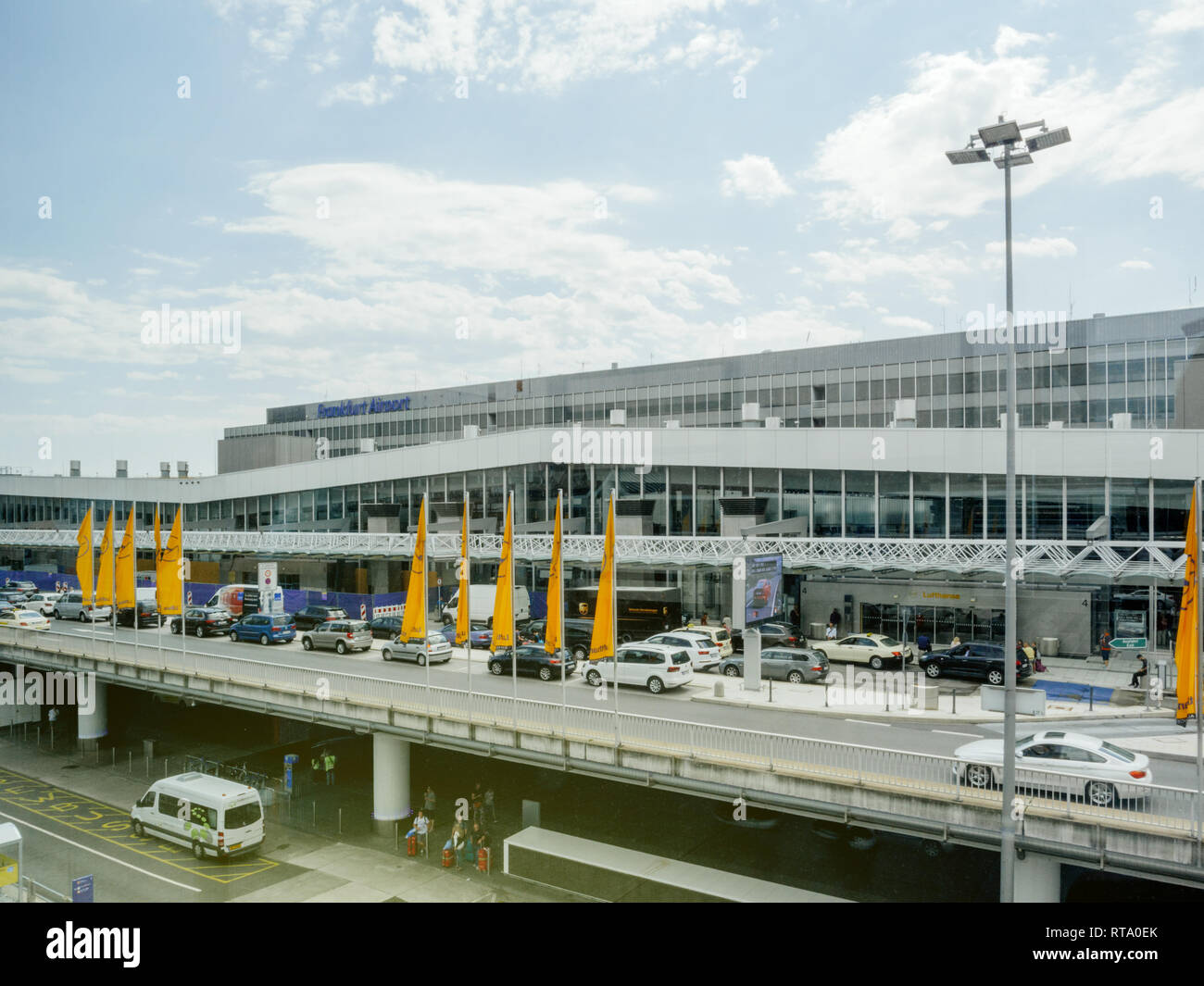 FRANKFURT, GERMANY - AUG 1, 2017: Cars dropping off and picking up passengers at Frankfurt airport departures and arrivals seen from the Squaire office building Lufthansa Stock Photo