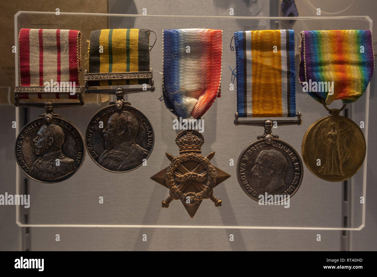 Line of medals from early 20th century including Persian Gulf 1909-1914, Somali land 1908-10, York Castle Museum, York, Yorkshire, UK. Stock Photo