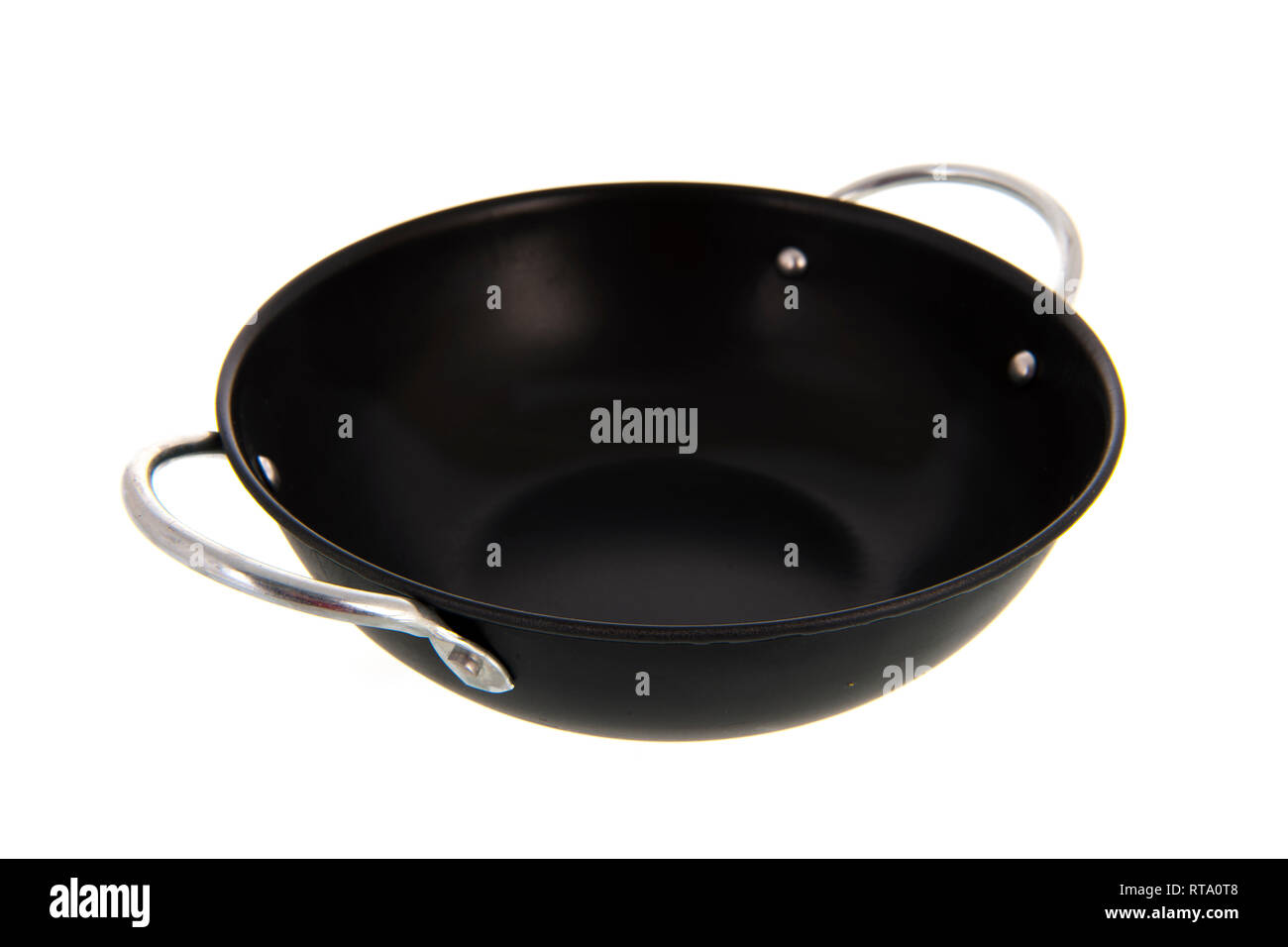 Empty black frying pan isolated over white background Stock Photo
