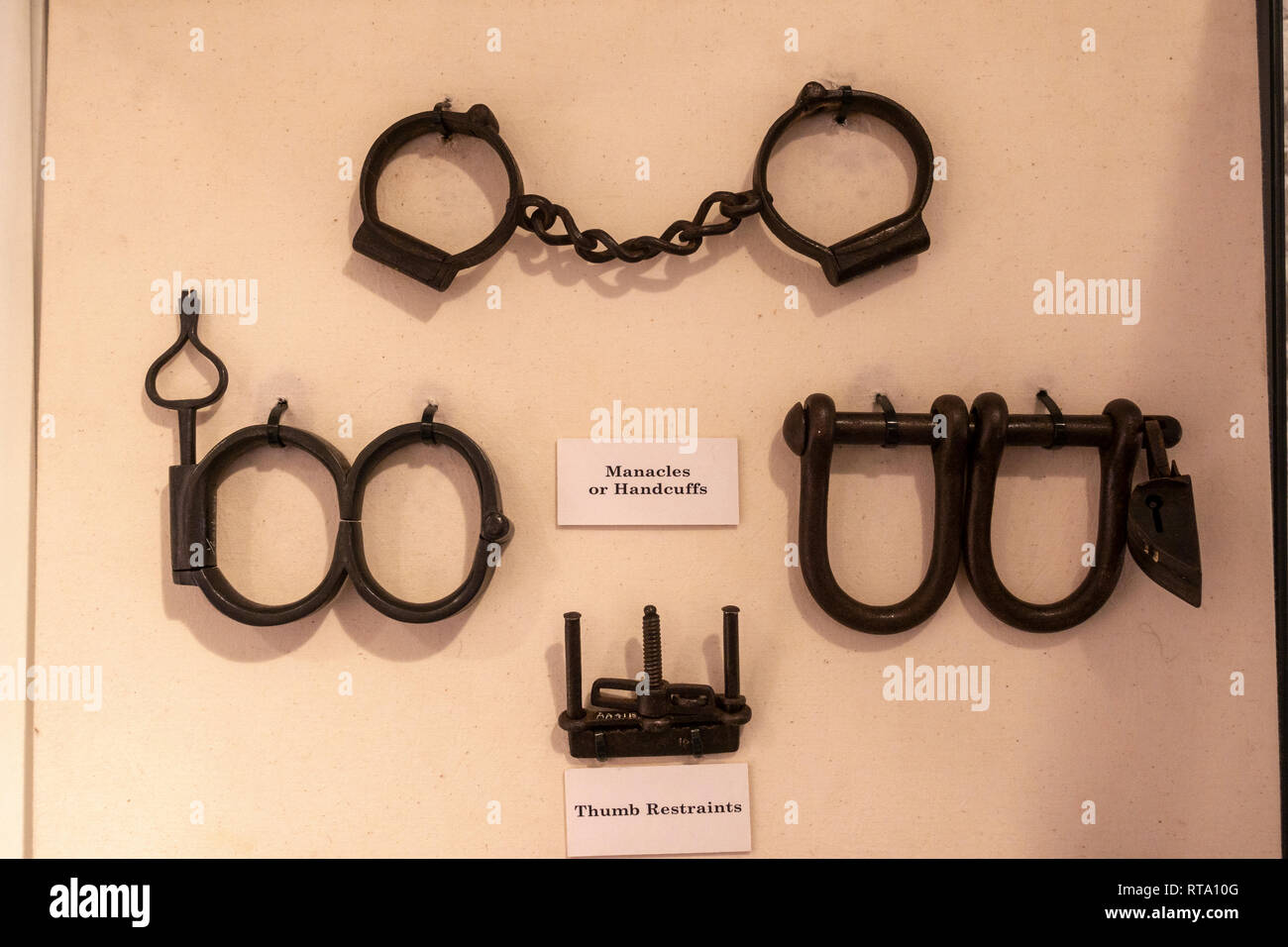 Manacles (or handcuffs) and thumb restraints in the Prison exhibition, York Castle Museum, York, Yorkshire, UK. Stock Photo