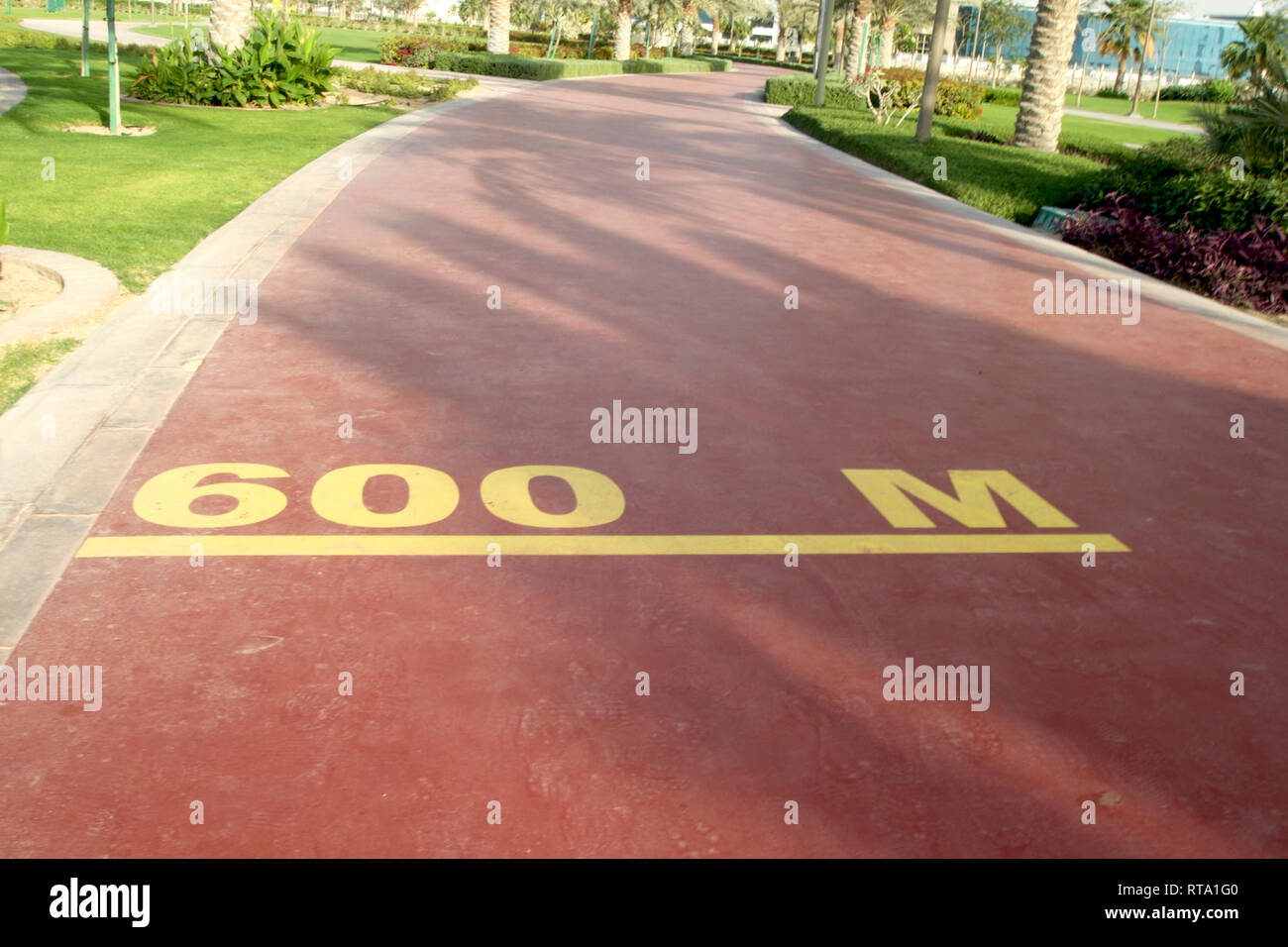 Dubai-Al Barsha Pond Park running track mark 600 M narrow Stock Photo