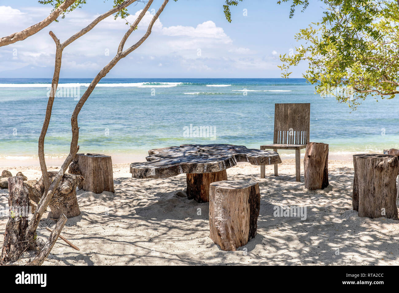 Wooden seating groups on the beach of Gili Trawangan, Indonesia. Stock Photo