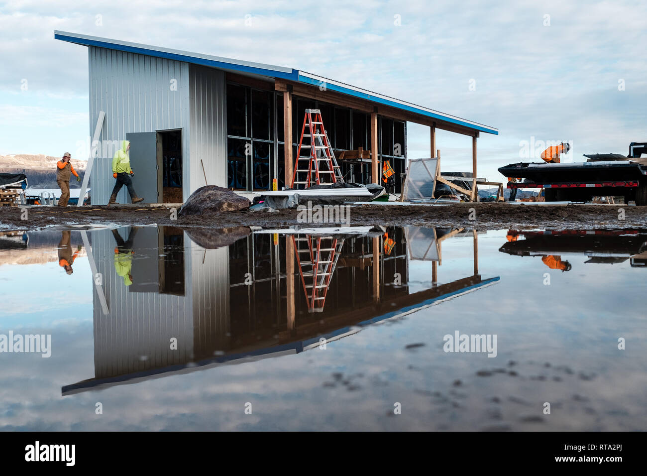 Under Construction In A Muddy Lot Are Dave Carlson S And